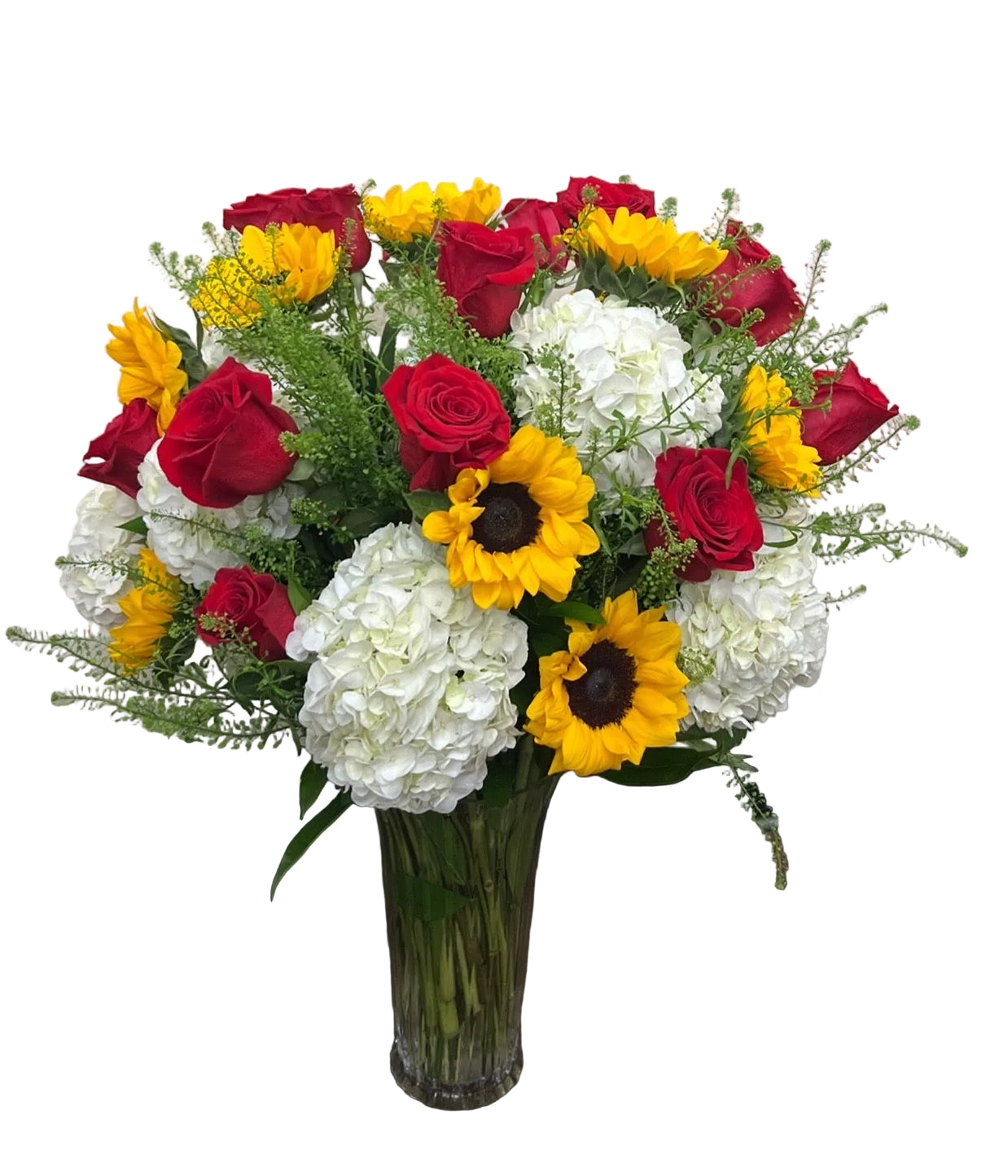 A beautifully arranged bouquet of red, yellow, and white flowers in a clear vase .